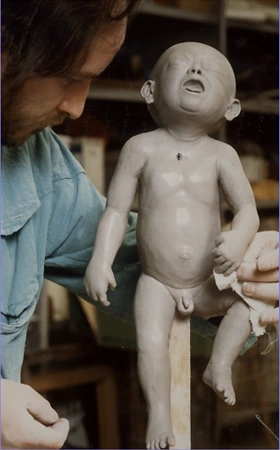 Jacques Gastineau sculpting a baby